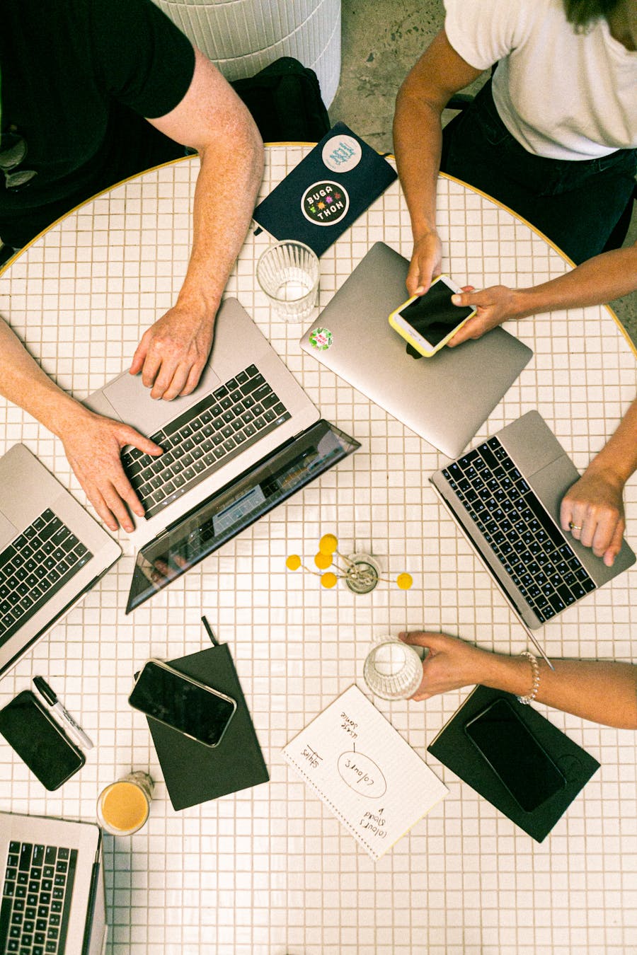 Laptop workspace with planning materials